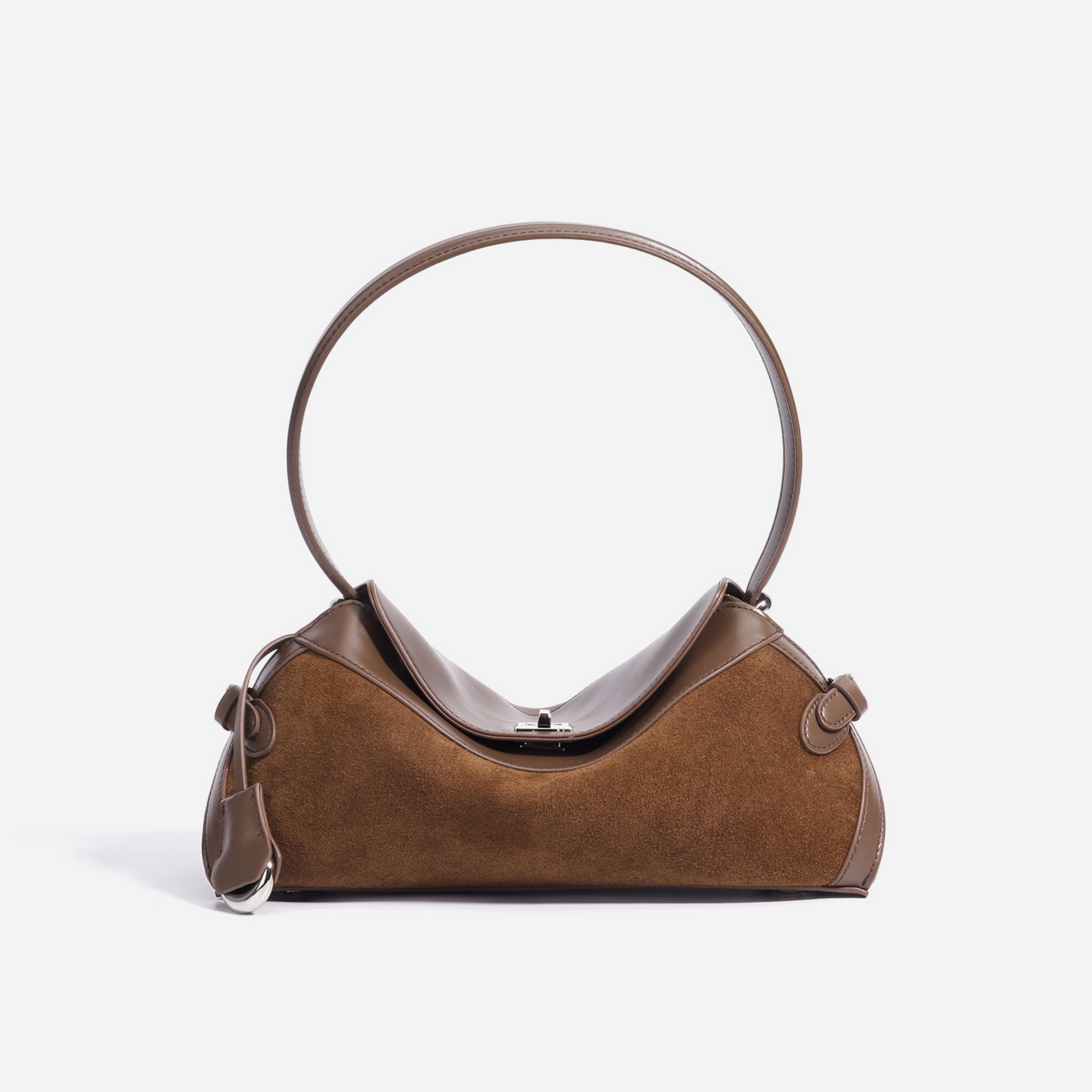 Light brown suede and leather handbag with circular handle, front view